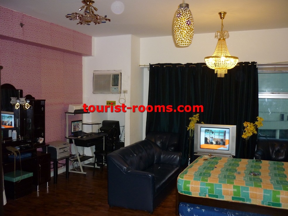 LIVING AREA OF ONE ADRIATICO PLACE CONDOMINIUM APARTMENT IN MALATE MANILA