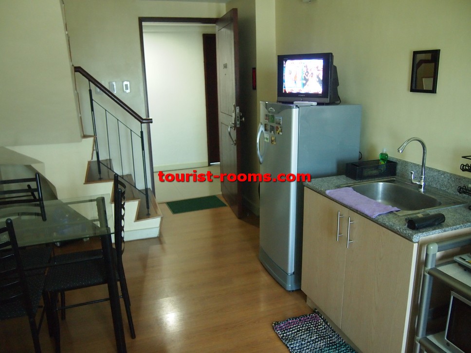 DINING AND KITCHEN AREA AND STAIRCASE AT GATEWAY GARDEN HEIGHTS,GATEWAY GARDEN HEIGHTS,MANILA APARTMENTS FOR RENT,APARTMENT NEAR BONI MRT STATION FOR RENT,APARTMENT NEAR FORUM ROBINSONS MALL FOR RENT,APARTMENT AT MANDALUYONG FOR RENT,MANDALUYONG APARTMENT,MANDALUYONG APARTMENT FOR RENT