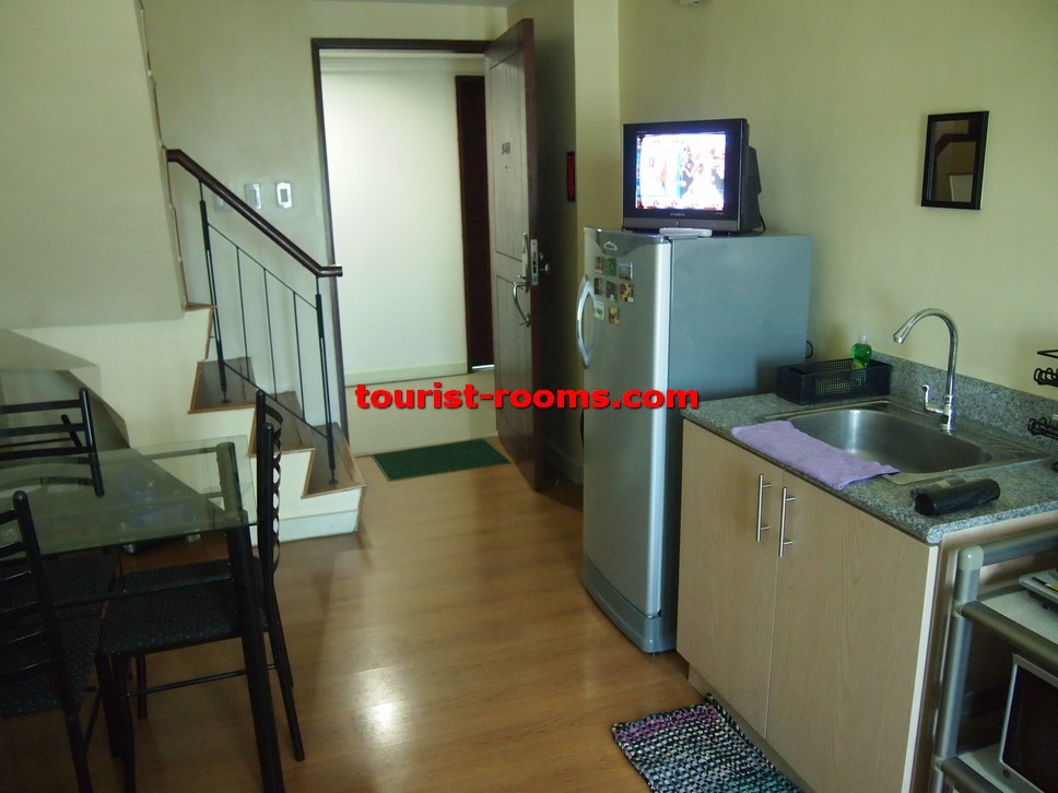  DINING AND KITCHEN AREA AND STAIRCASE AT GATEWAY GARDEN HEIGHTS,GATEWAY GARDEN HEIGHTS,MANILA APARTMENTS FOR RENT,APARTMENT NEAR BONI MRT STATION FOR RENT,APARTMENT NEAR FORUM ROBINSONS MALL FOR RENT,APARTMENT AT MANDALUYONG FOR RENT,MANDALUYONG APARTMENT,MANDALUYONG APARTMENT FOR RENT