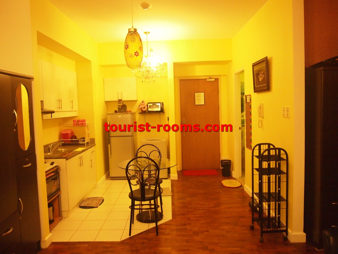DINING TABLE IN KITCHEN OF ONE ADRIATICO PLACE CONDOMINIUM APARTMENT IN MALATE MANILA