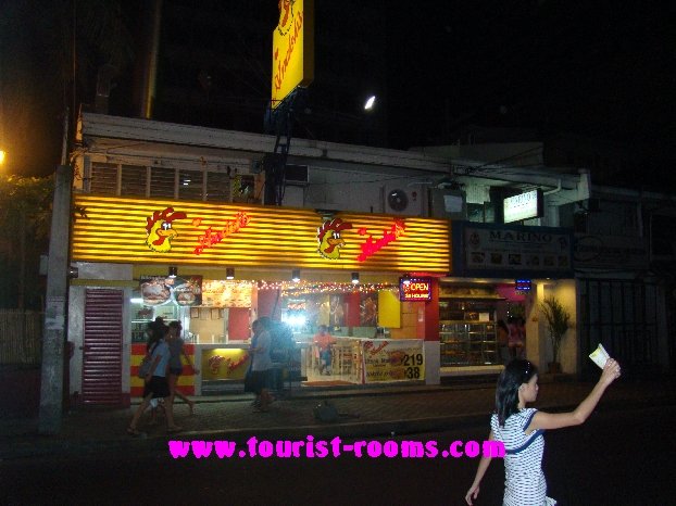 MANILA DEPARTMENT SHOPPING MALL GIRLS WALKING PAST FAST FOOD RESTAURANT